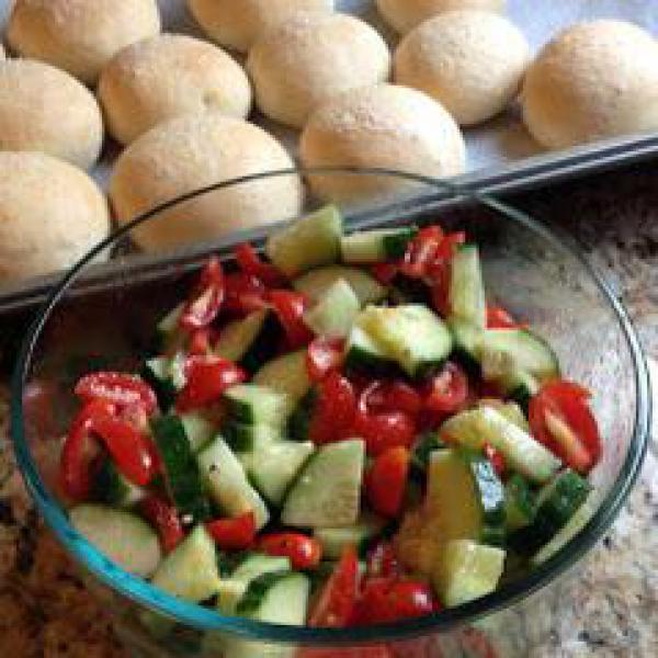 Rolls and tomato cucumber salad